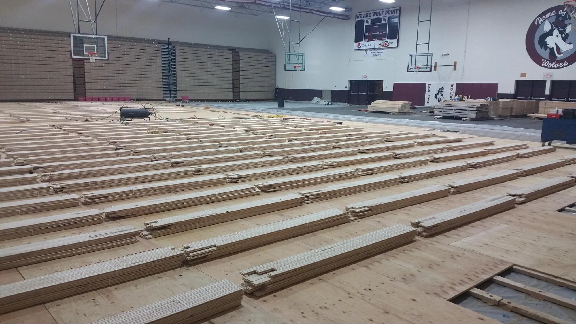 Subfloor installed with the bundles of Maple stocked on top of the sub floor system.